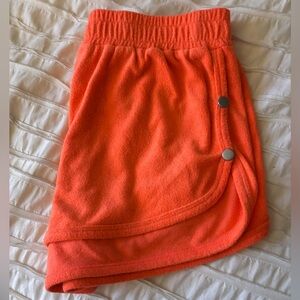 urban outfitters neon orange terry cloth shorts with snap buttons